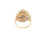 1.50ctw Oval and Baguette Sapphire and 0.20ctw Diamond Frame Spiral Ring in 14K
