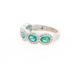 1.50ctw Oval Emerald and 0.25ctw Diamond Frame Ring in 14K