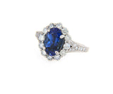 2.71ct Oval Tanzanite and 1.12ctw Diamond Frame Ring in 14K
