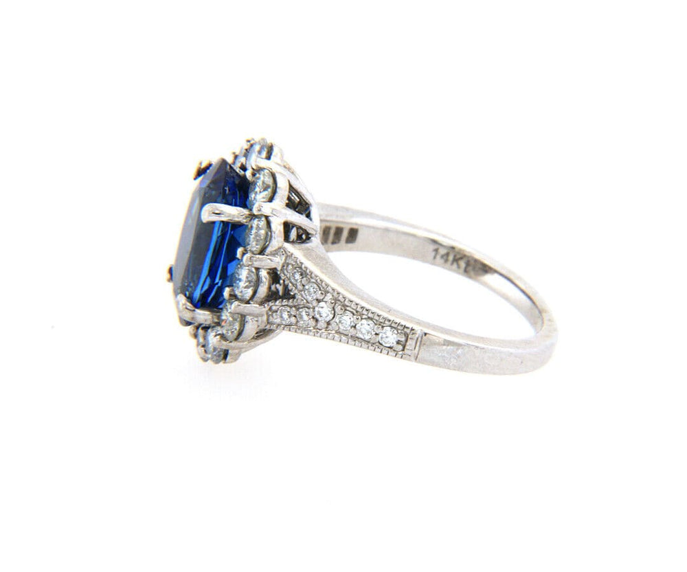 2.71ct Oval Tanzanite and 1.12ctw Diamond Frame Ring in 14K